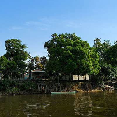 Wooden huts and housing on the banks of the River Jari