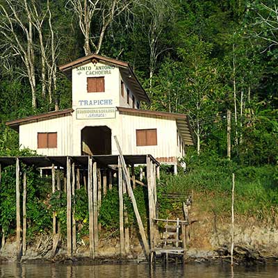 Wooden huts and housing on the banks of the River Jari