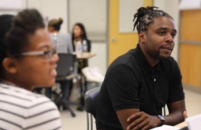 Two Relay students in a workshop