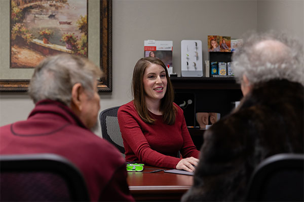 audiologist talking with patients