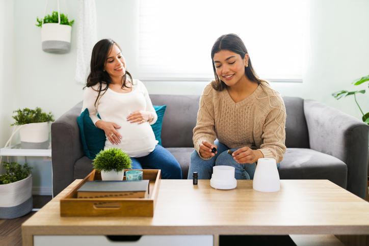 Doula using essential oils to help create a relaxing environment.
