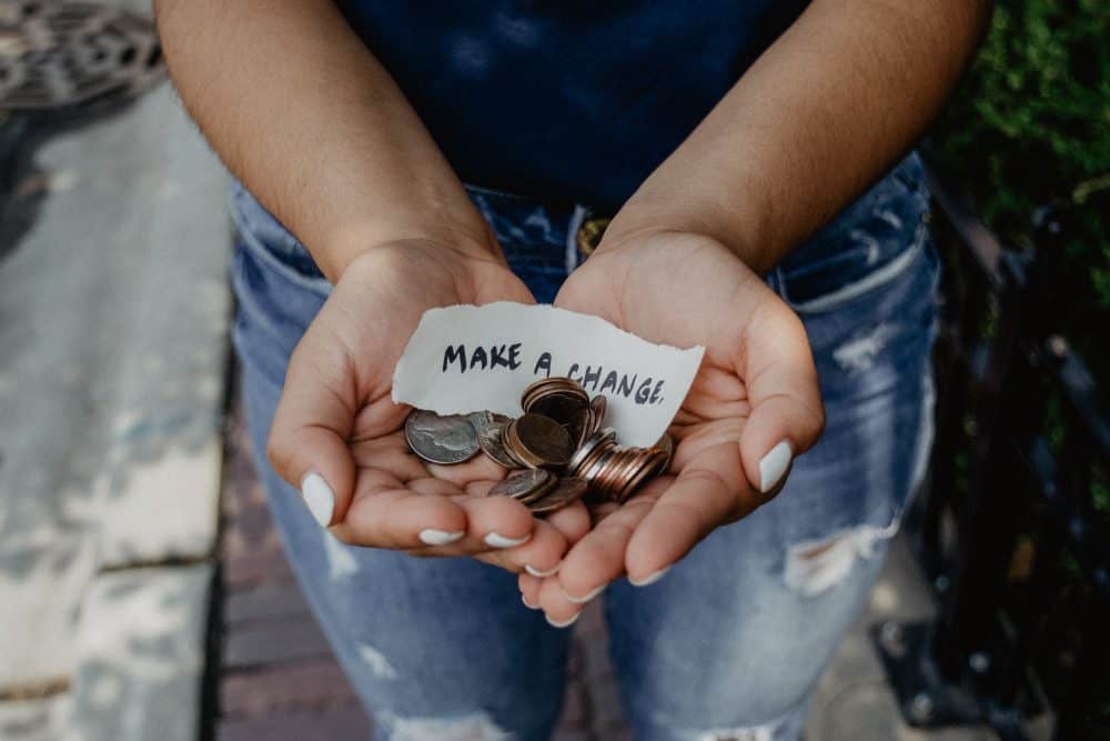 Hands with money - Photo by Katt Yukawa on Unsplash