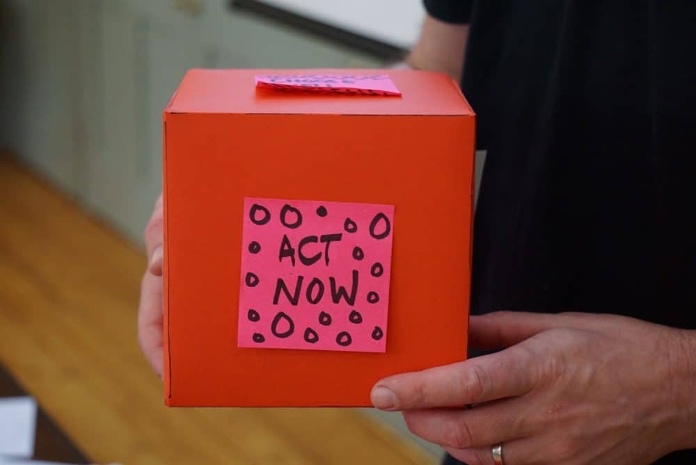 Red donation box - Photo by Jo Szczepanska on Unsplash