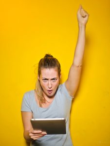 Lady cheering Credit: Pexels Andrea Piacquadio