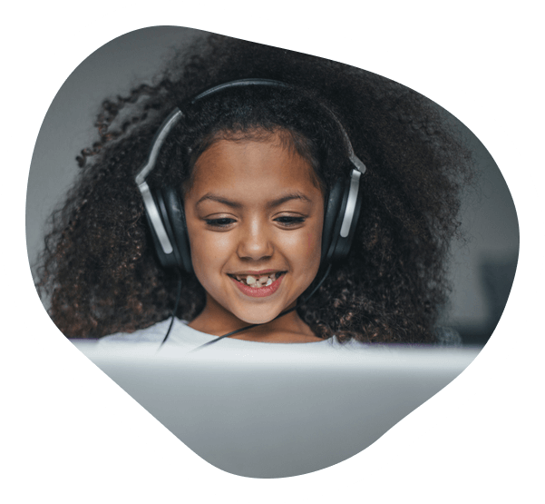 Student smiling listening to headphones
