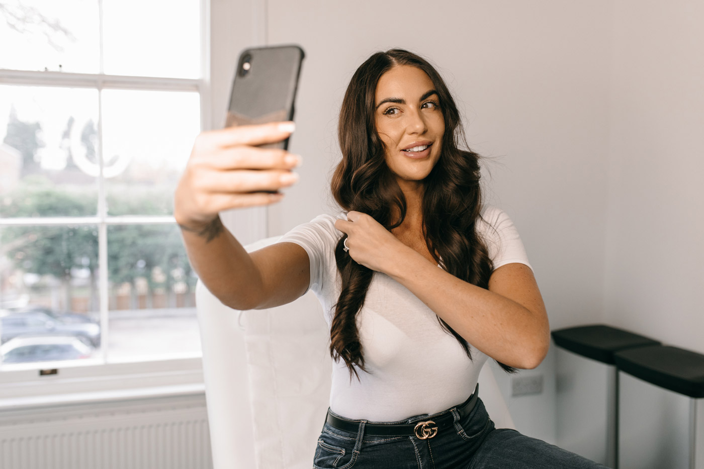 happy client looking at herself
