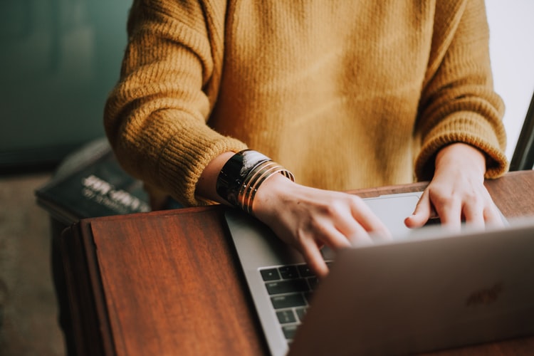 a woman carrying out online transactions with cryptocurrency