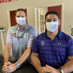 Two ATC Fitness employees wearing face masks