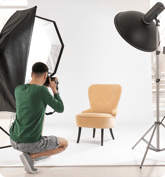 Man talking photos in a studio.