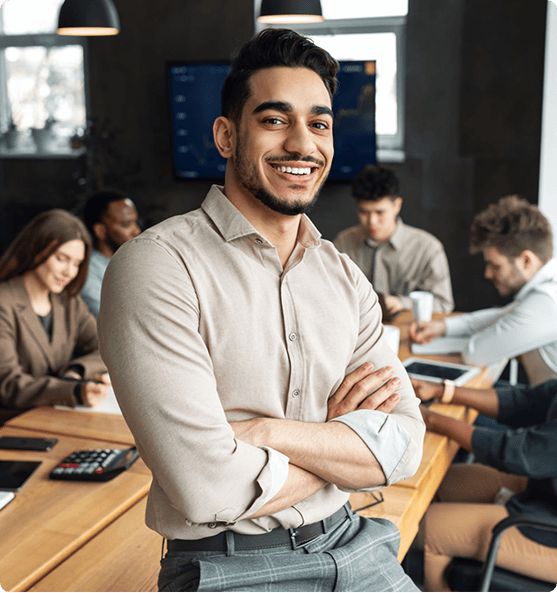 Guy on crossed arms and smiling.