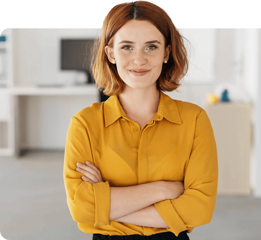 Woman in crossed arms smiling at camera.