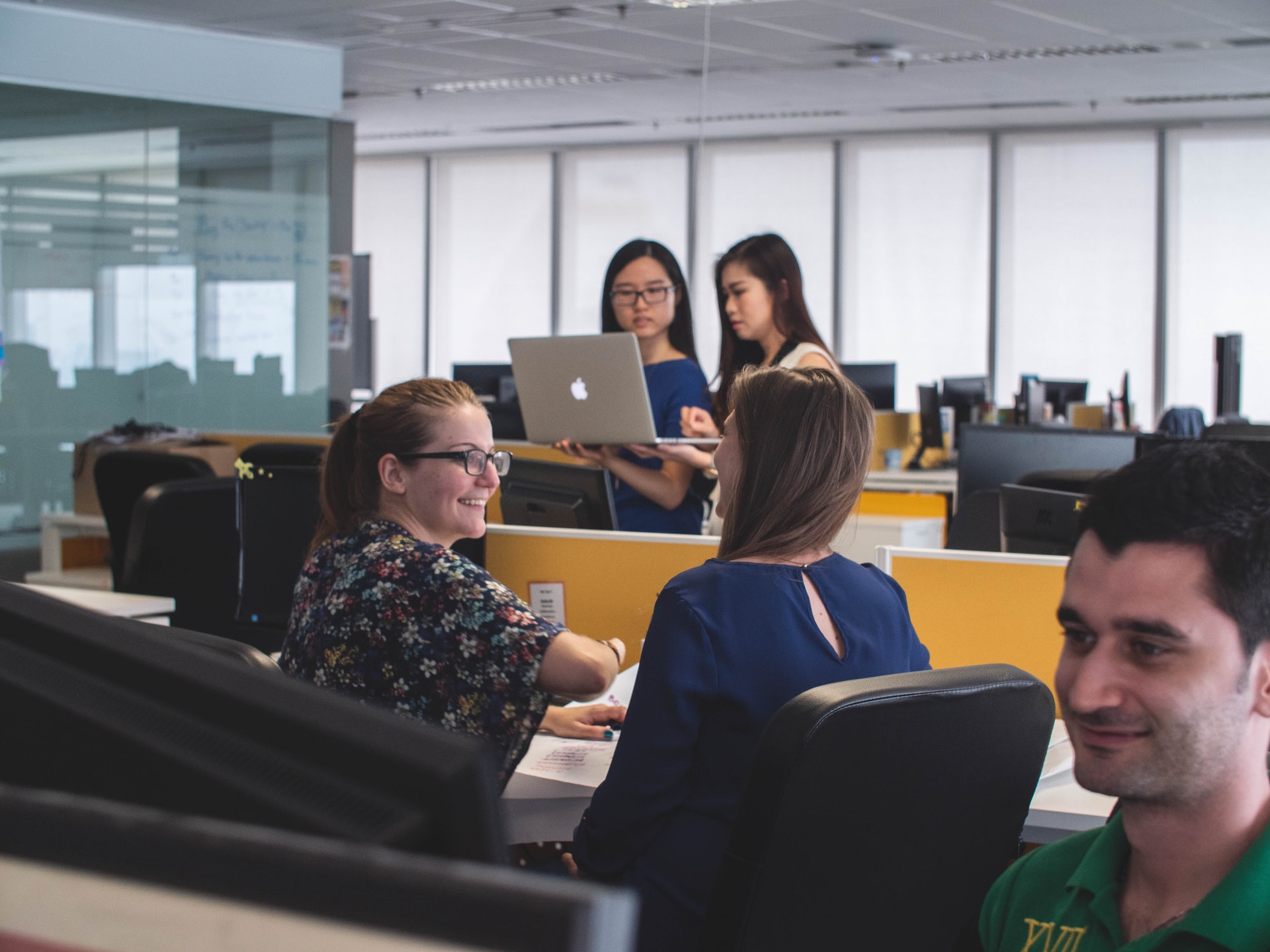 Coworkers discussing NetSuite updates.
