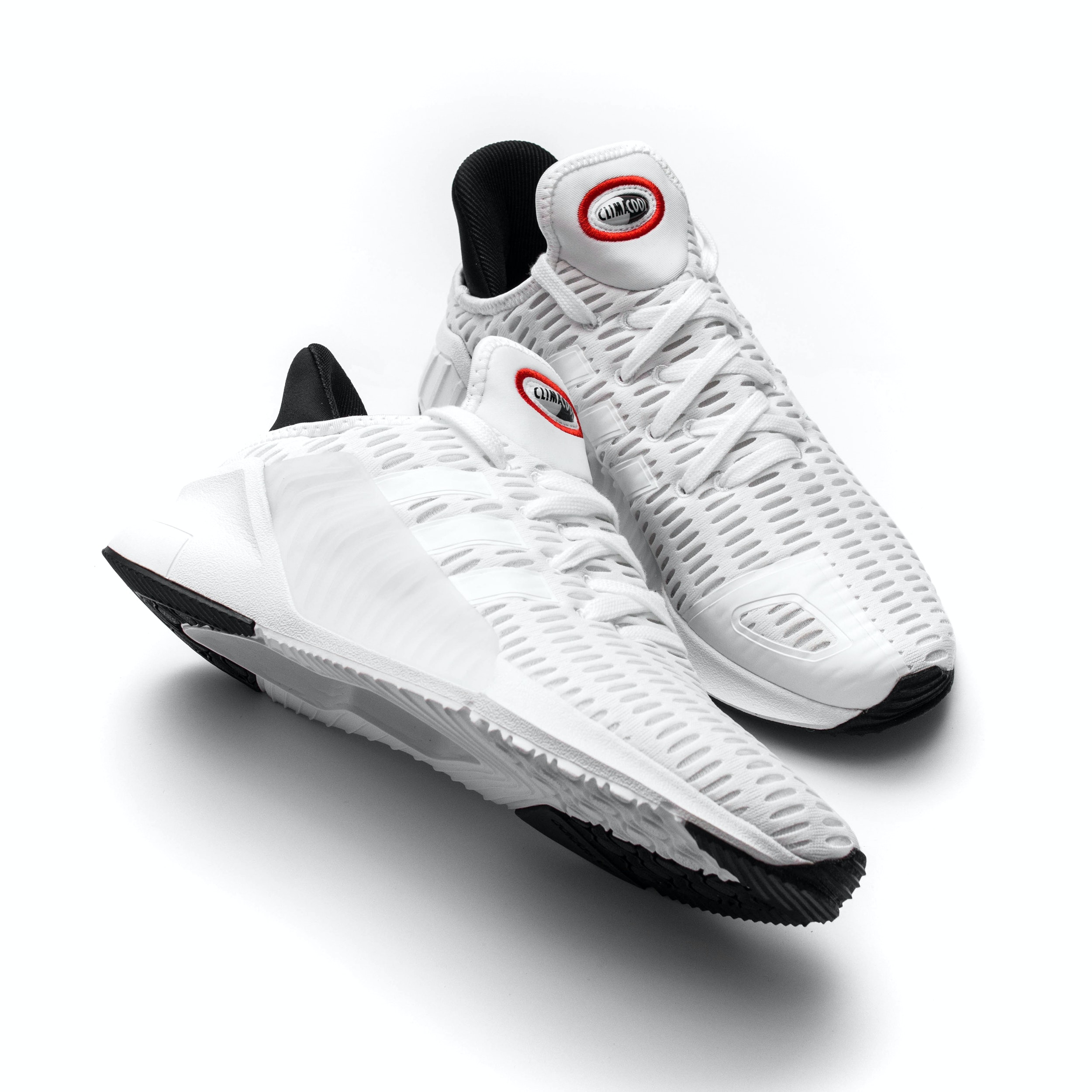 Different angle, pair of black sneakers shoes on white background