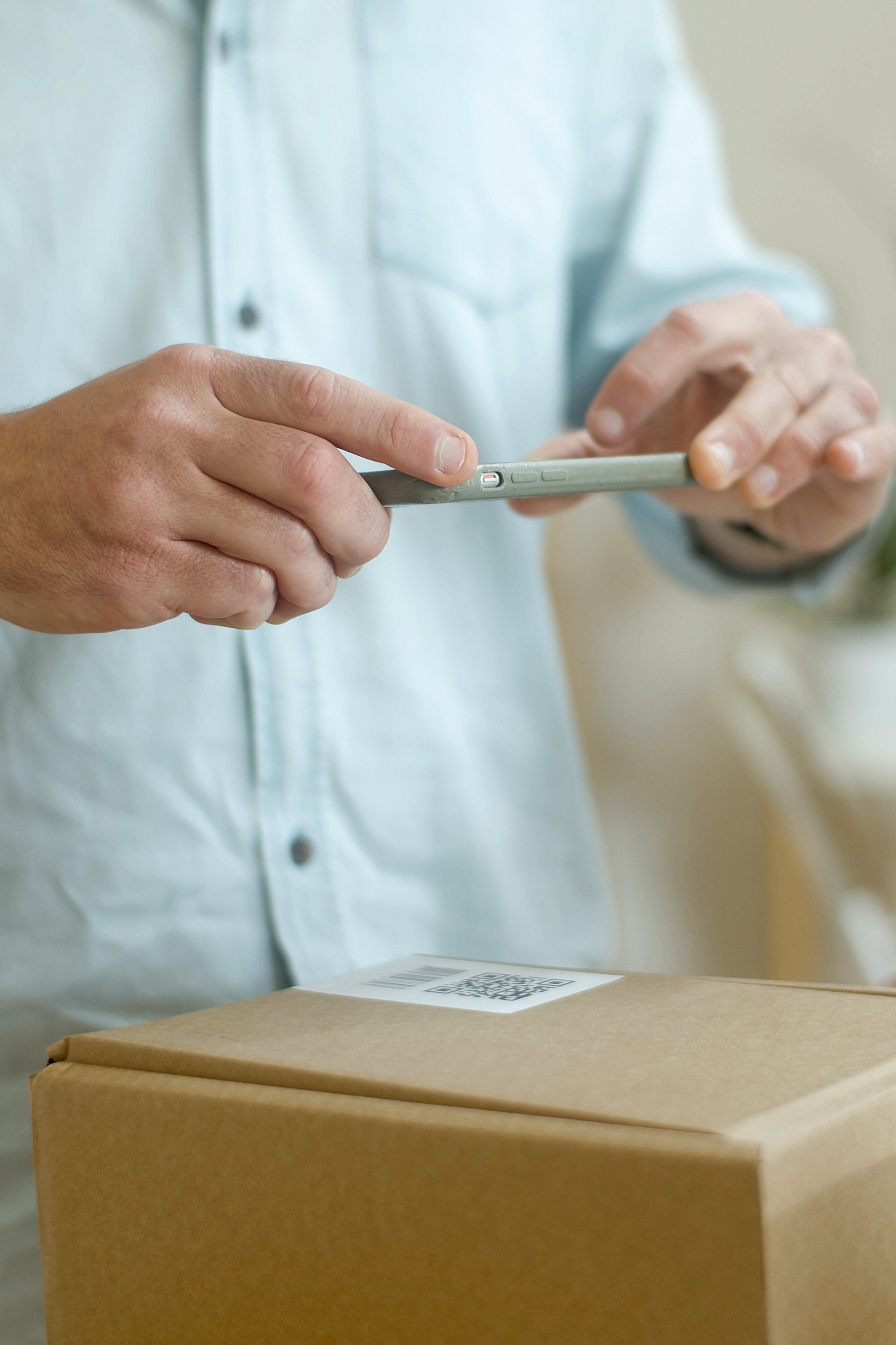 Person taking photo of package