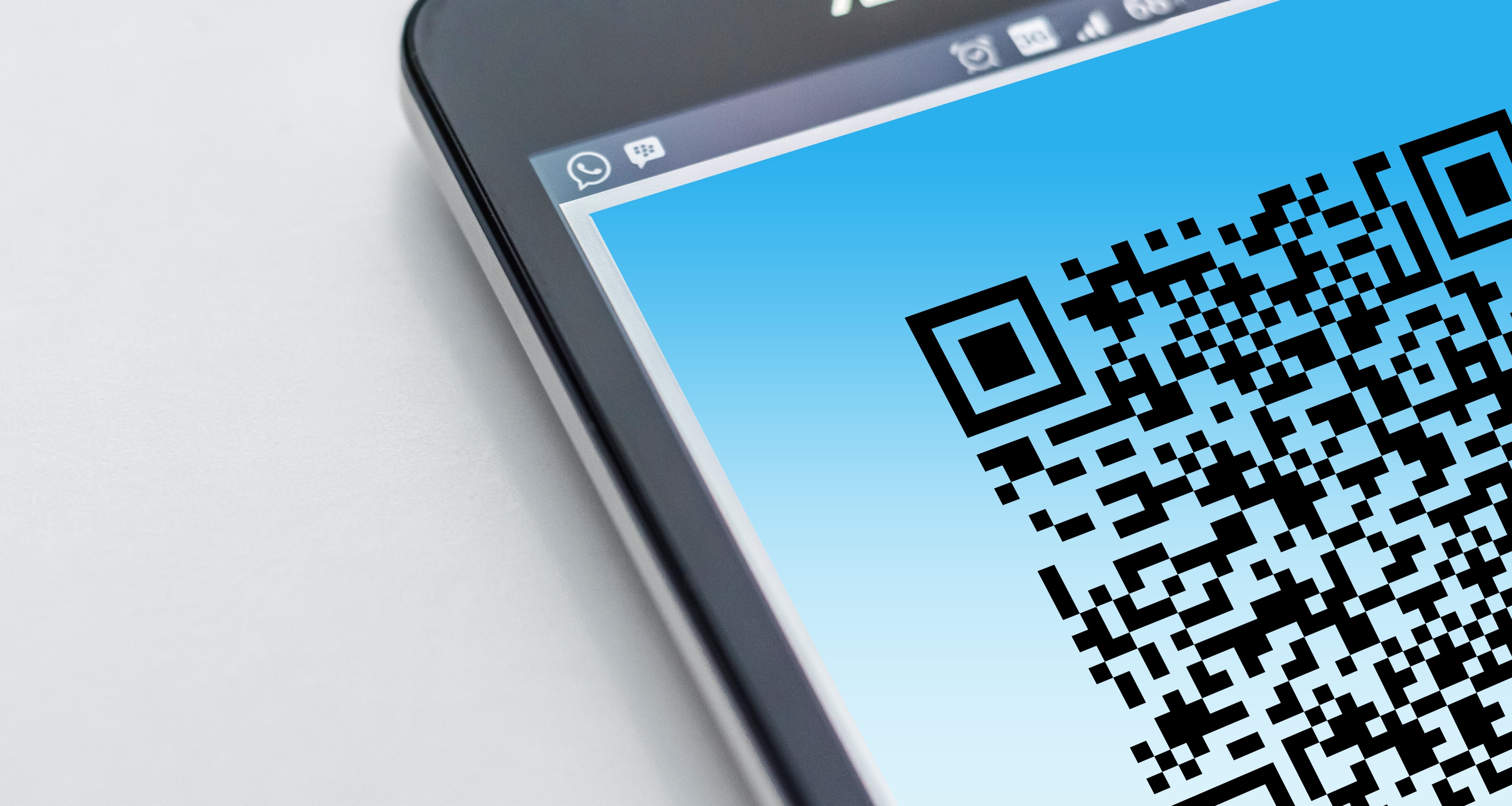 Woman scanning barcode with phone