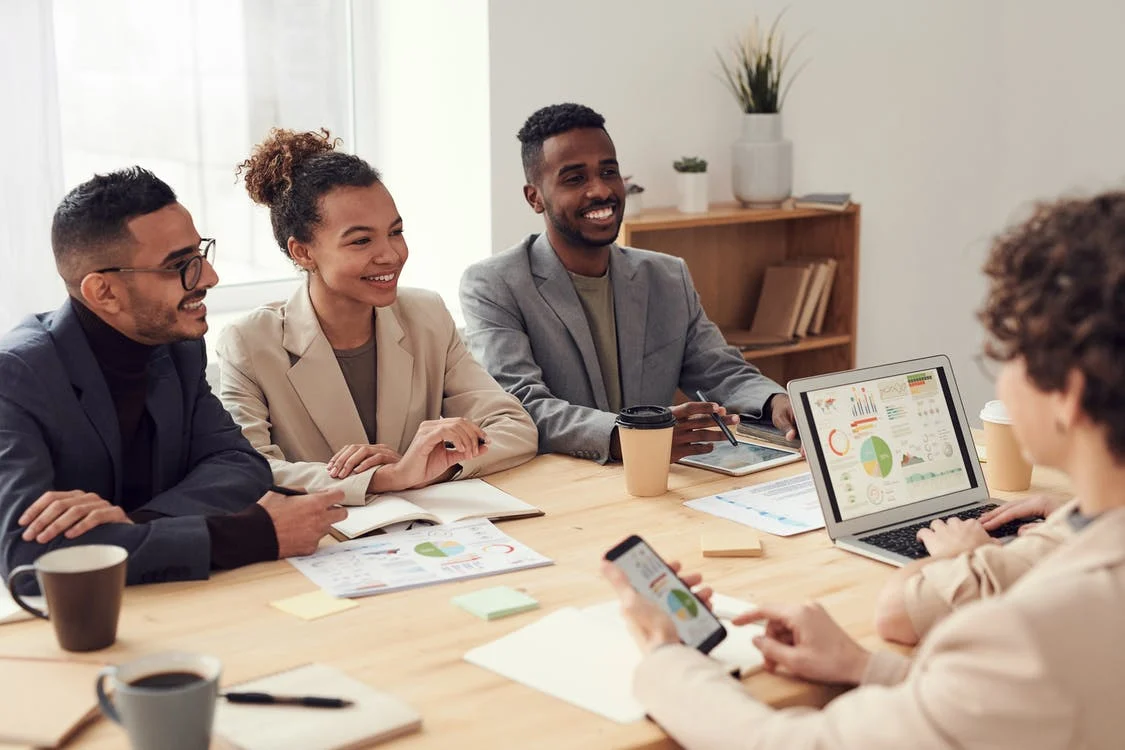 People smiling in a meeting
