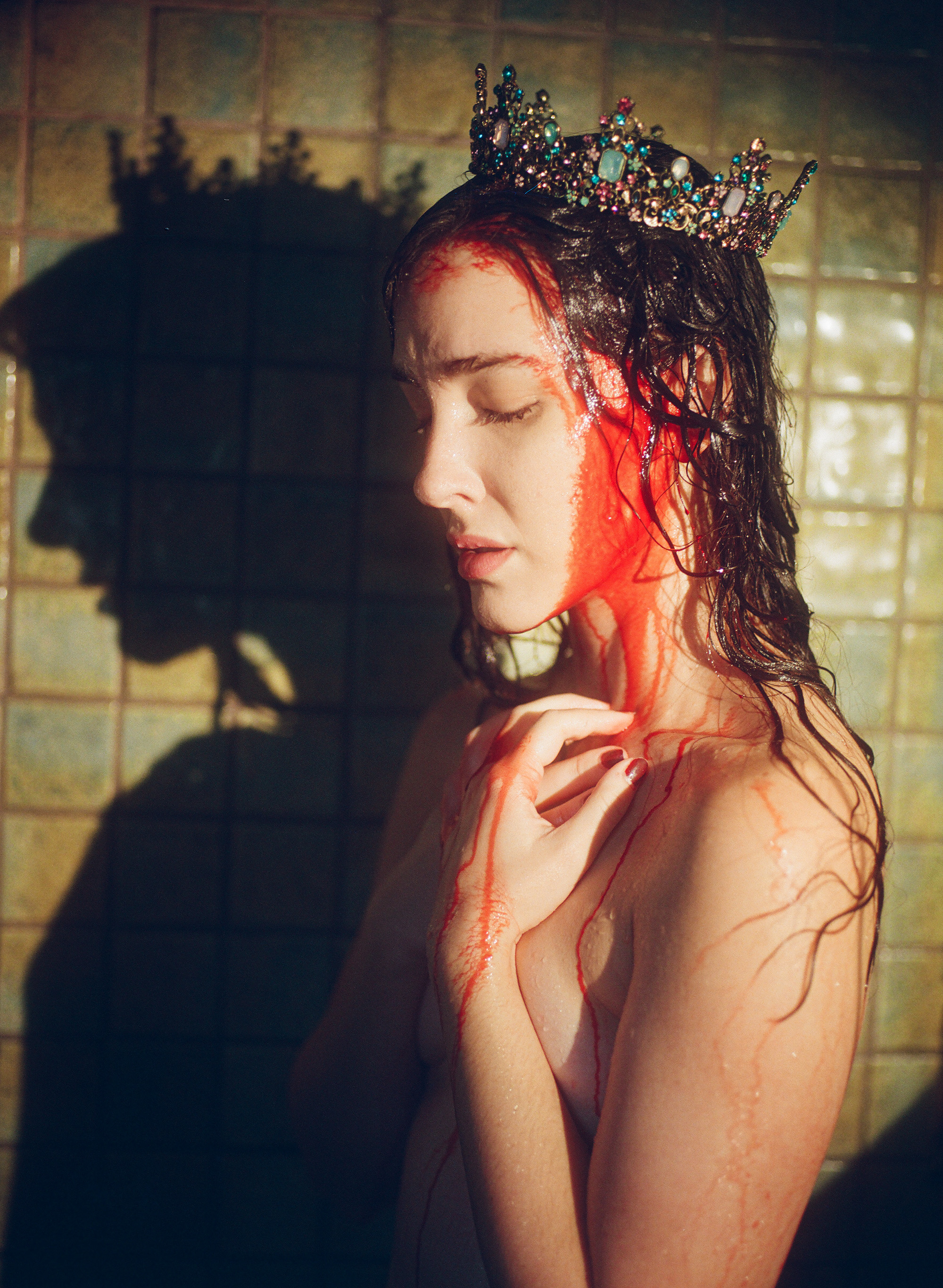 Rose in the shower with a crown on and blood running down her head.
