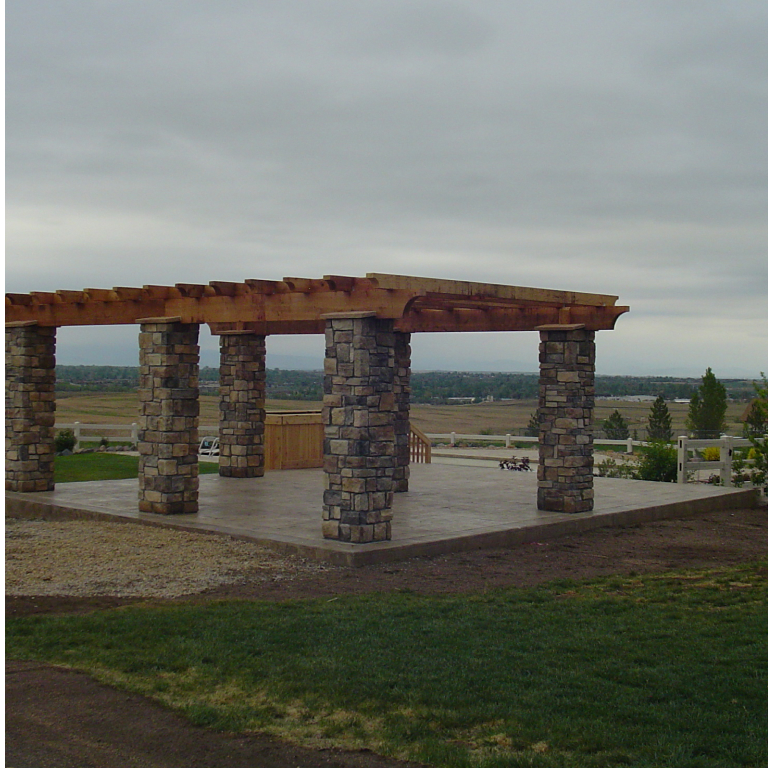 Detached Heavy Timber Pergola over Concrete Patio with Faux stone wrapped decorative columns