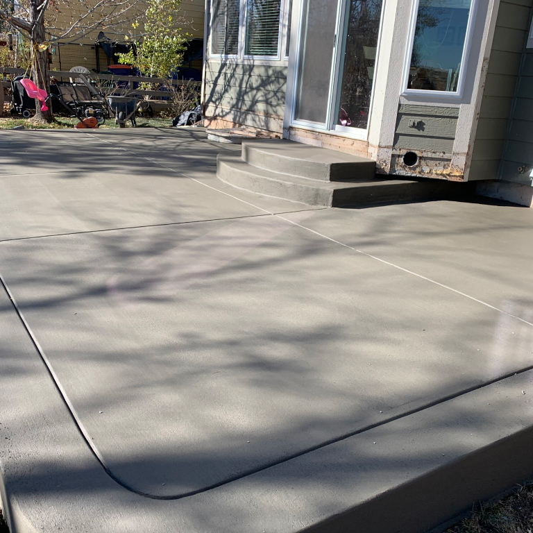 Standard gray Concrete Patio with two steps