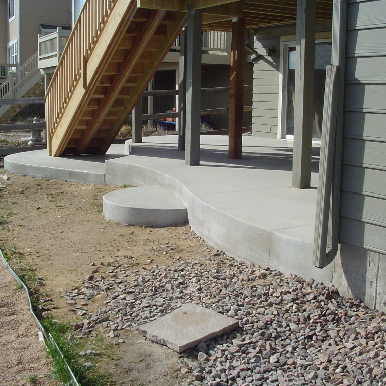 Standard gray Concrete Patio with Curved Edging
