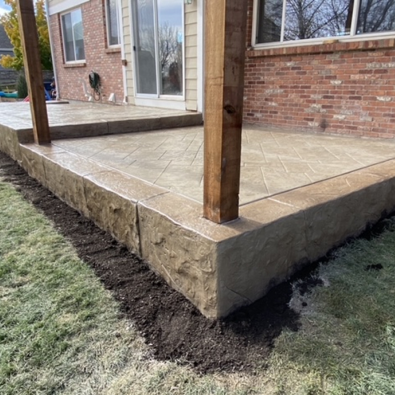 Decorative Stamped Concrete Patio with Chiseled edging in tan color