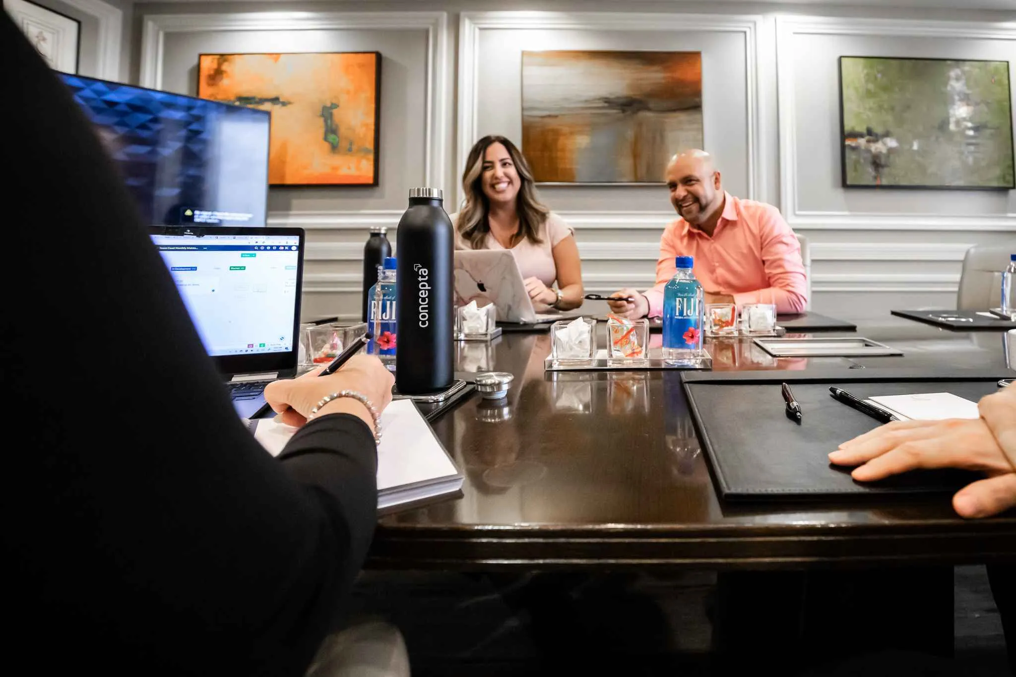 concepta team in the meeting room, concepta water bottle first plan