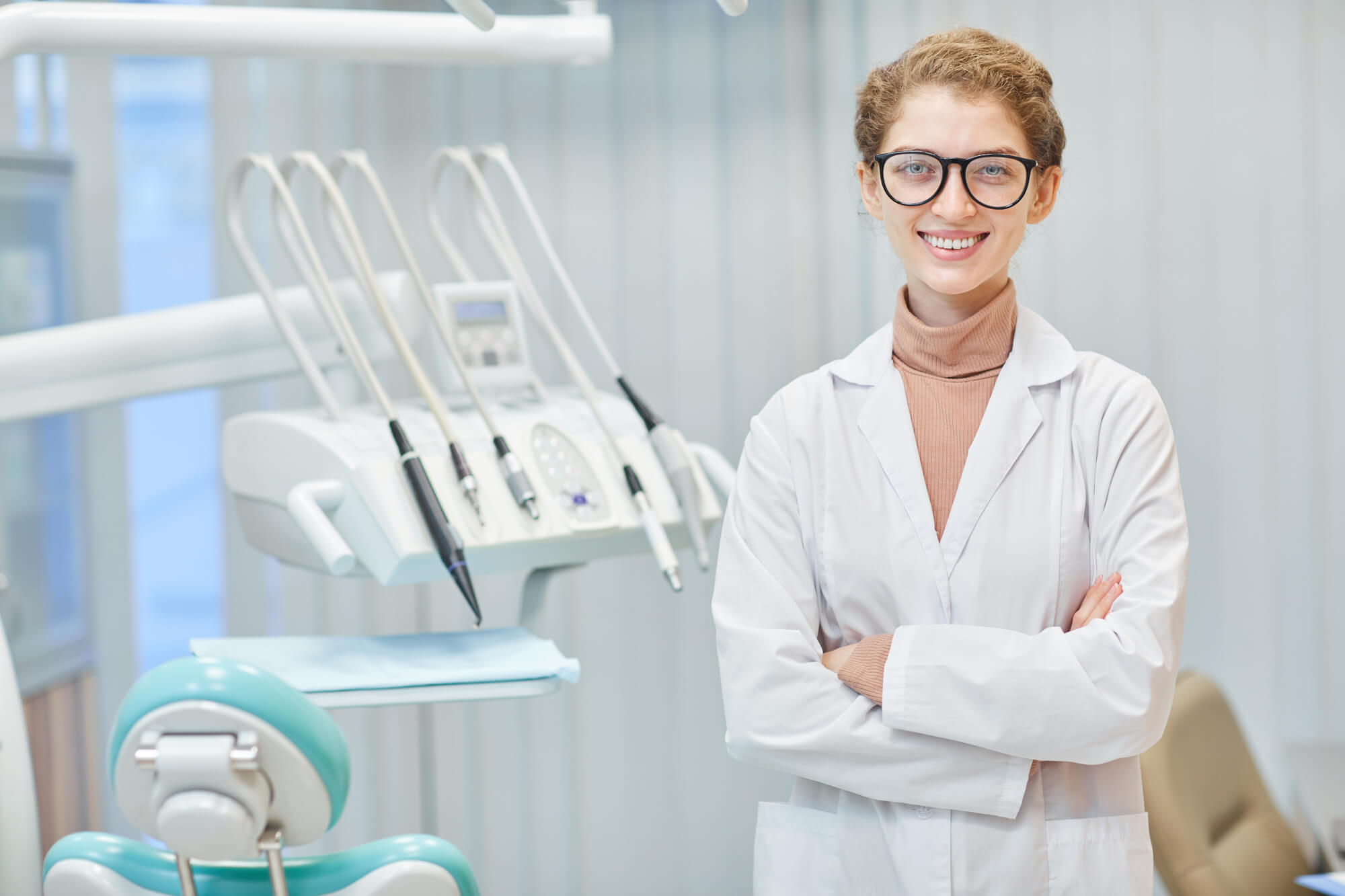 dentist poses and smiles after dental cleanings in Hopedale, IL