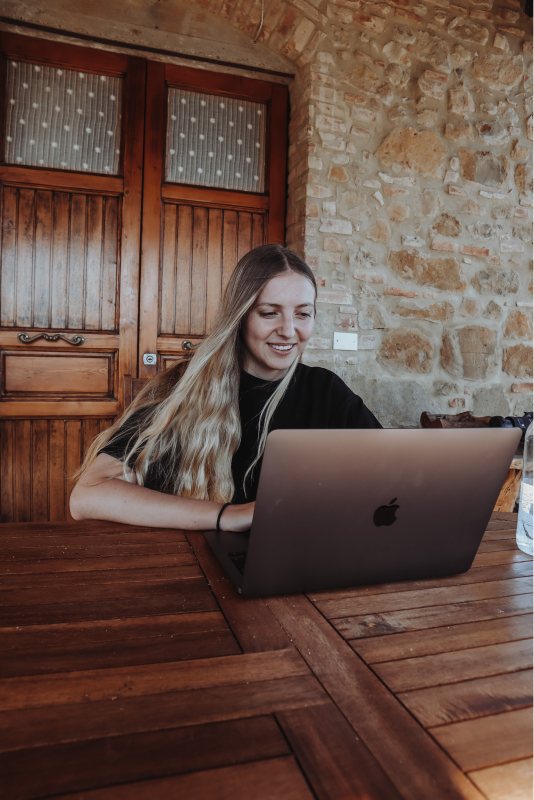 woman working on macbook