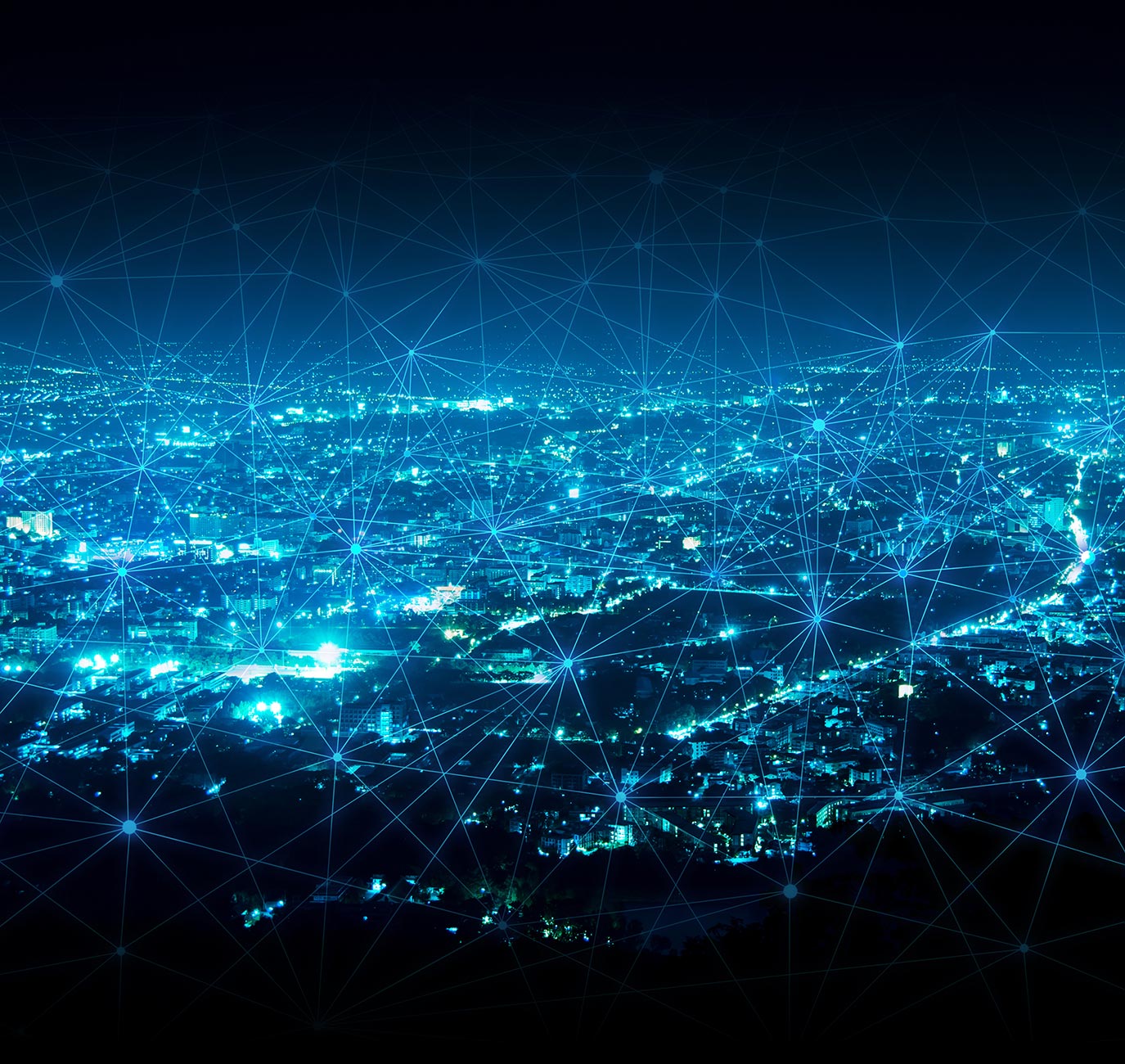 network nodes lines overlaid on nighttime aerial view of city