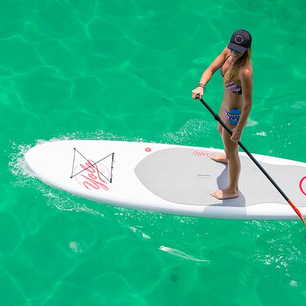 A person paddle boarding at The Henderson