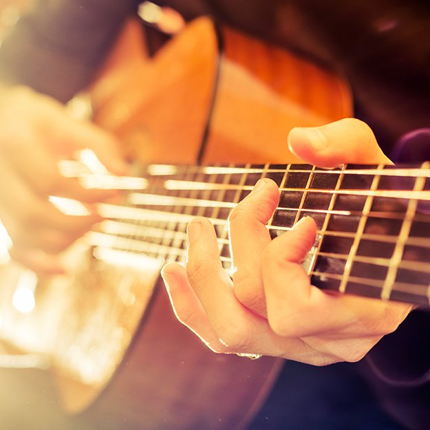 A person playing a guitar