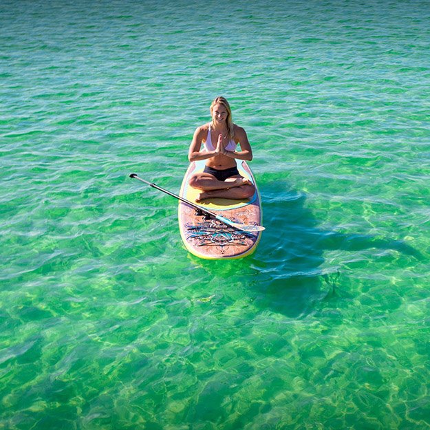A person paddle boarding in Destin Florida