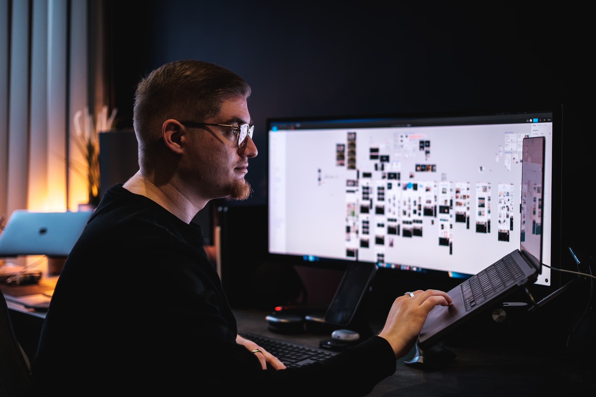 Web designer working on design projects at his desk