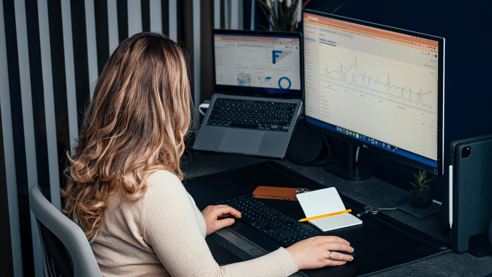 Picture of a woman working on SEO campaigns at her desk