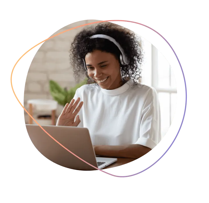 A woman attending a telehealth appointment on her laptop