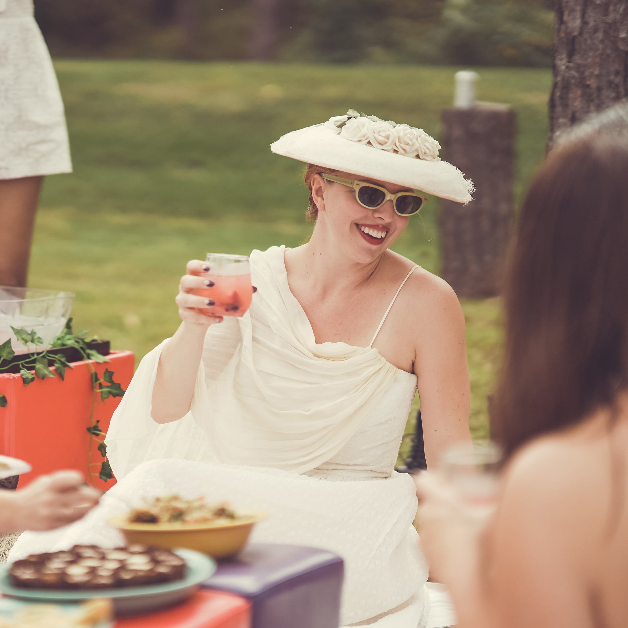 Dressed up Girlie at a Tea Party smiling with a drink