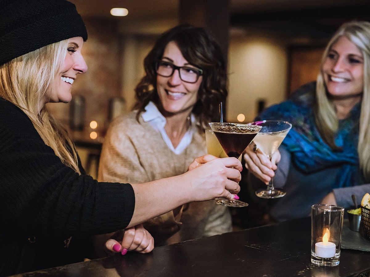 Three Girlies toasting martinis at Layla's Bar + Kitchen