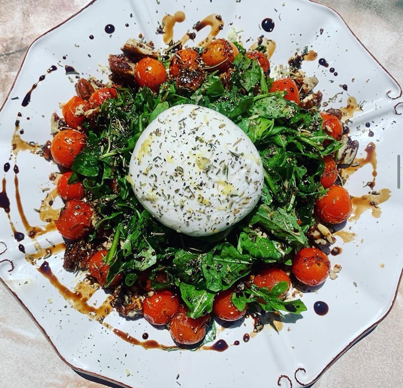 A plate of burrata salad from Siren Song Winery