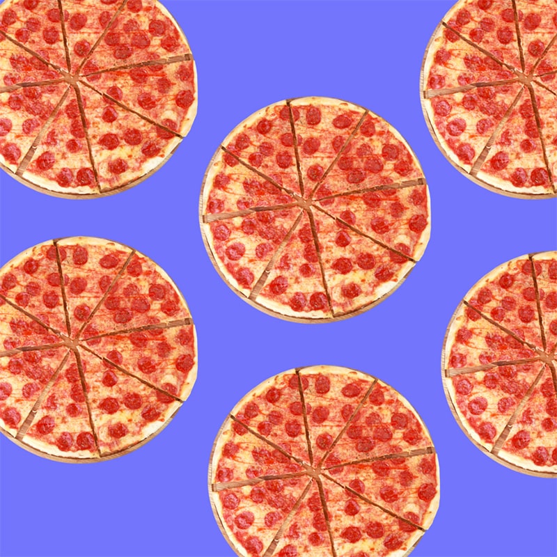 Multiple pizza pies on a solid background