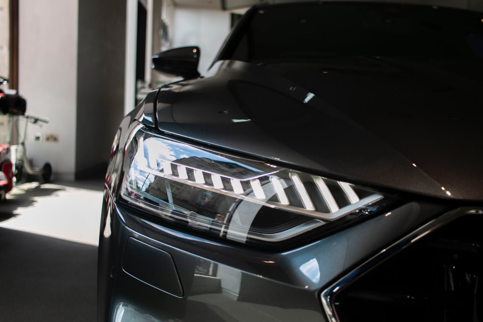 Darkgrey car in a garage