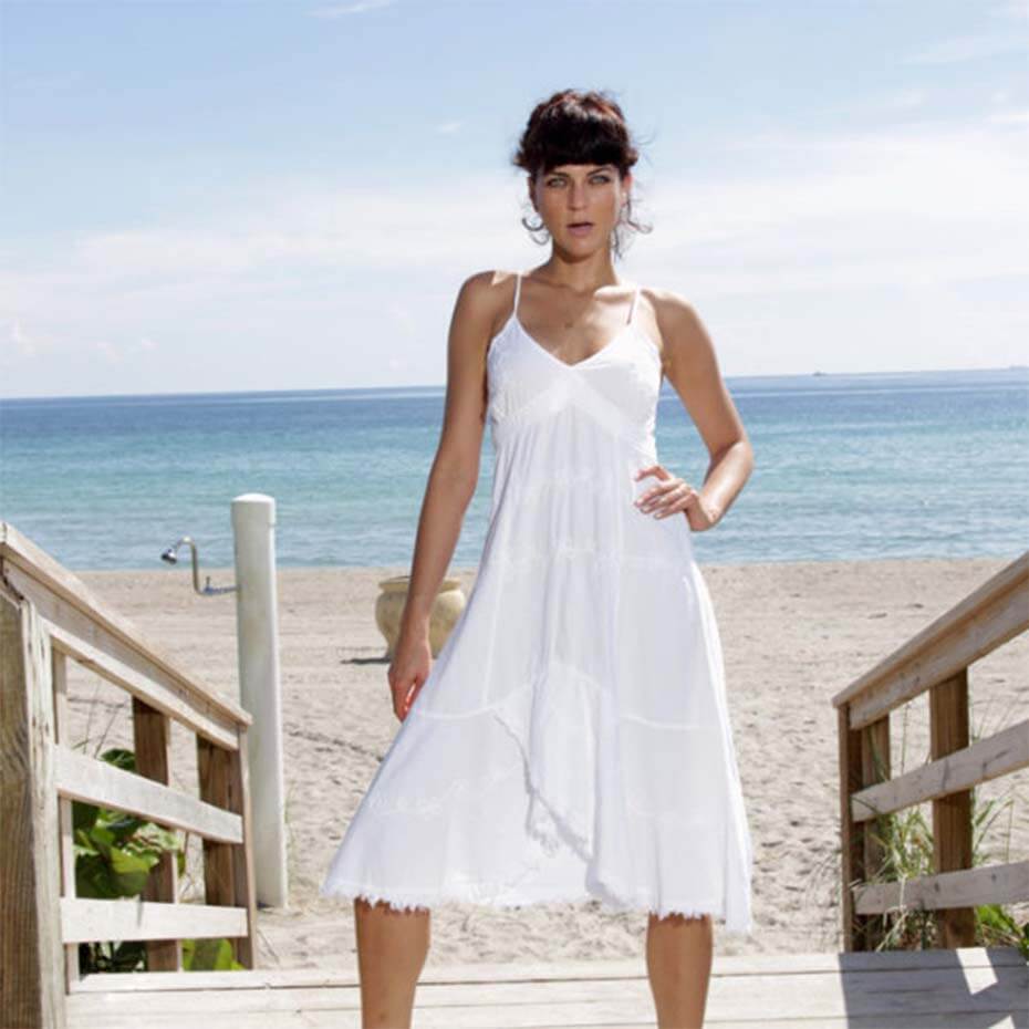 Woman wearing Giocam white dress.