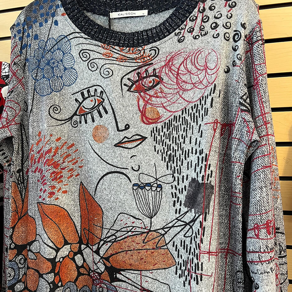 Grey long-sleeve Kalisson blouse at Malena & Magda's Boutique.