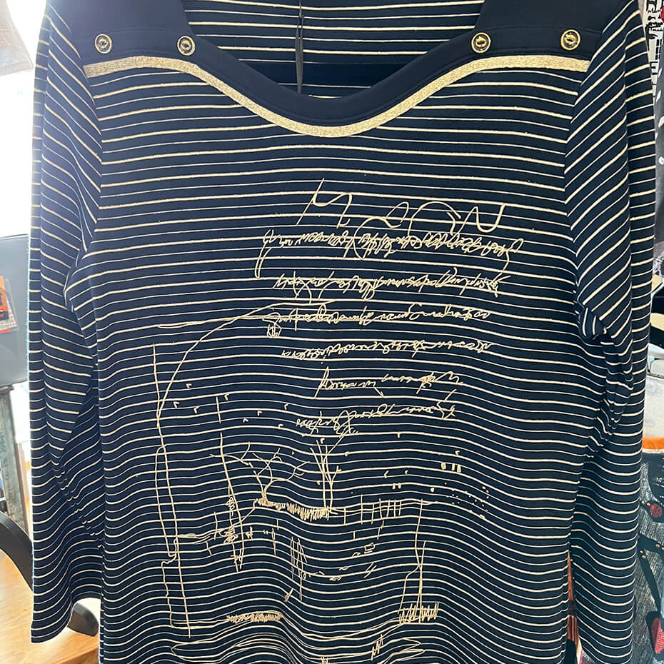 Navy short-sleeve Kalisson blouse with gold stitching at Malena & Magda's Boutique.