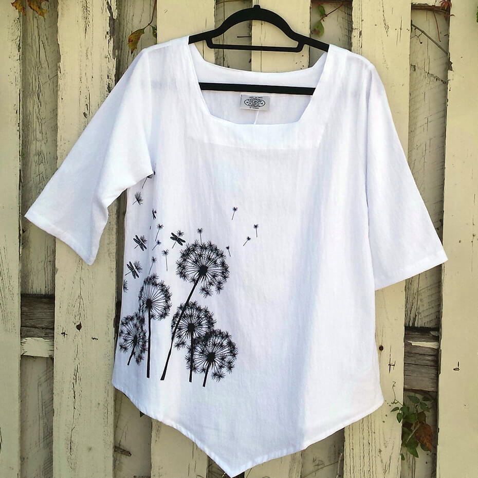 White Cottonseed blouse with dandelions at Malena and Magda's Boutique.