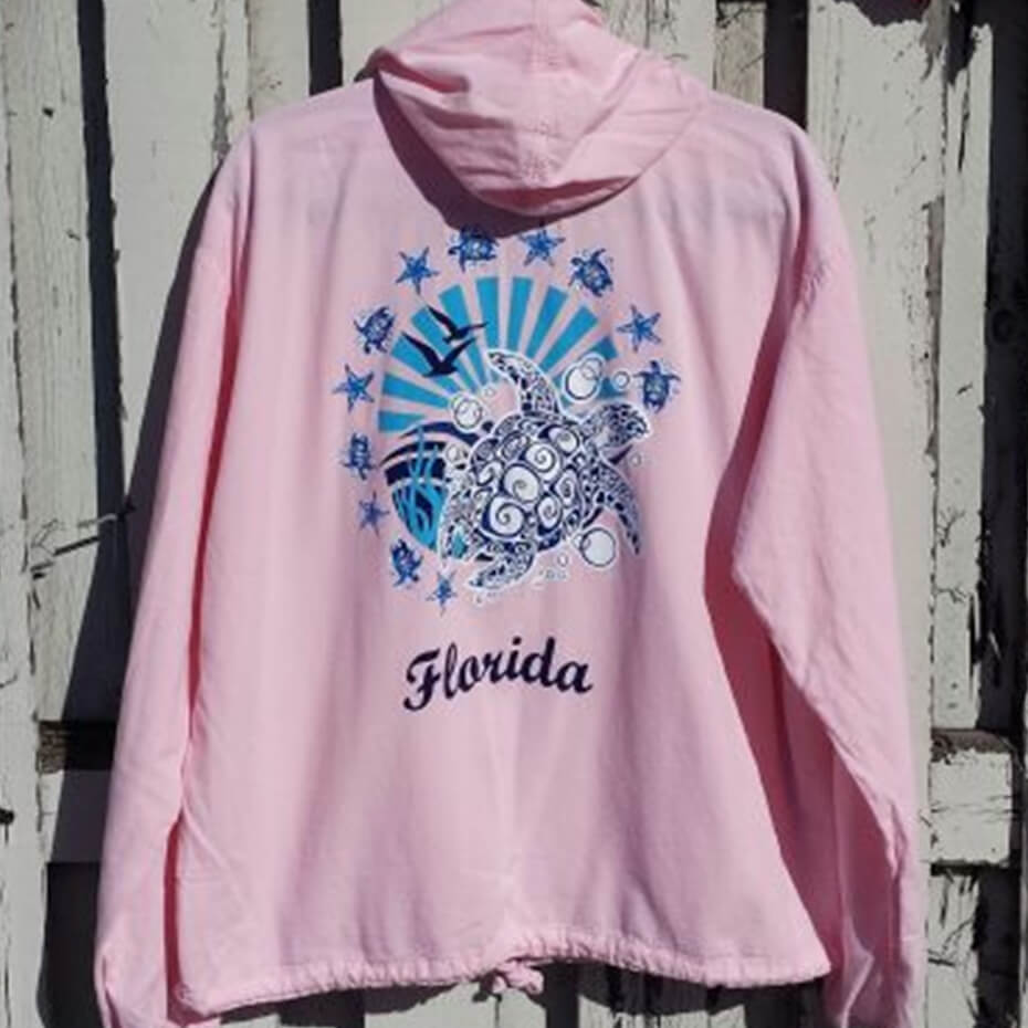 Pink Cottonseed sweatshirt with Florida text and an illustration of a sea turtle at Malena and Magda's Boutique.