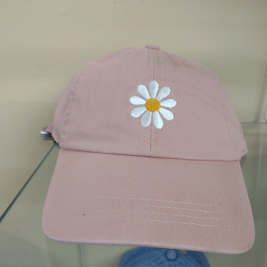 Pink flower hat at Malena and Magda's Boutique.