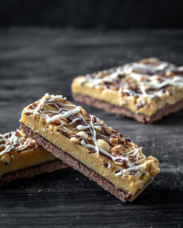 Three pieces of gooey salted caramel slice