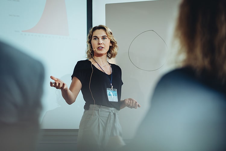 A speaker giving a talk at an employee event