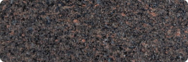 close up of refinishing option "red granite". is it a speckled mix of black, blue grey, grey brown, and warm beige.