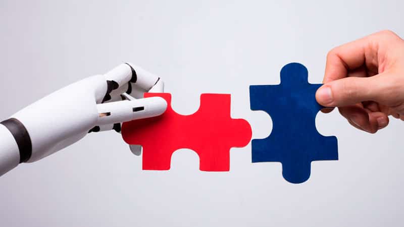 Robothand holding puzzel piece